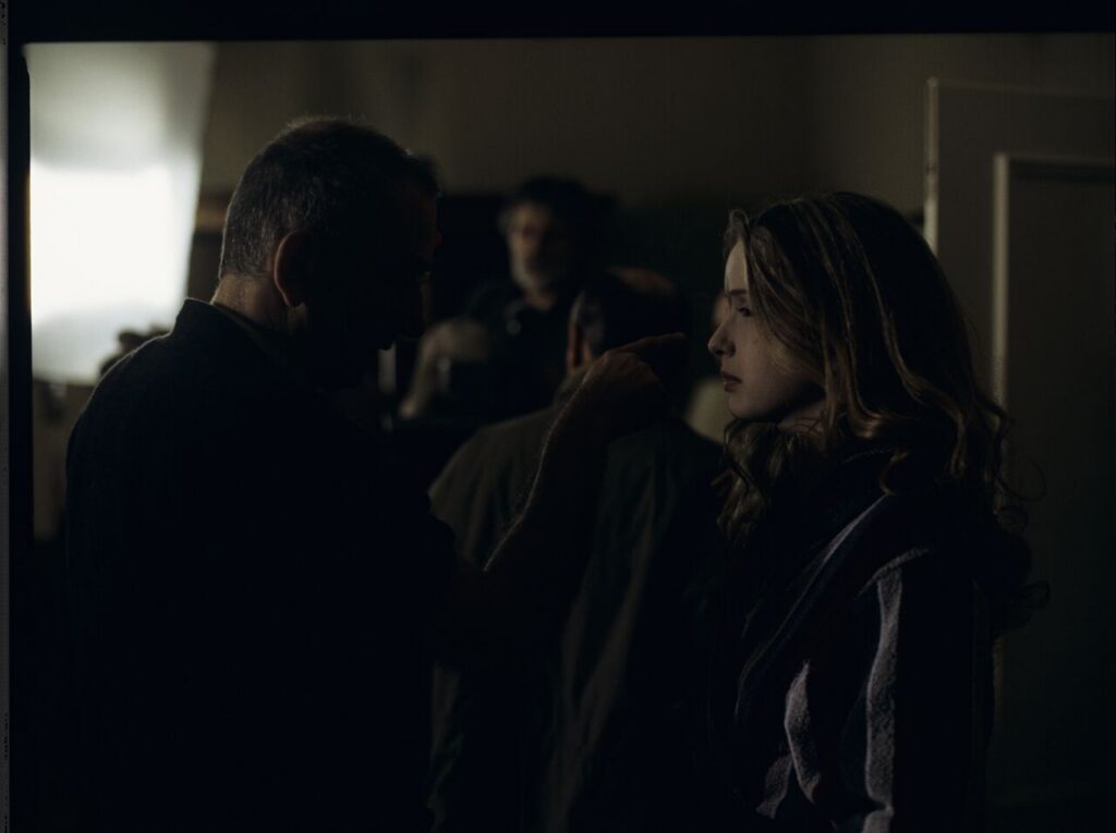 Krzysztof Kieślowski (director) talks to actress Julie Delpy (playing the role of Dominique) during a break between takes.