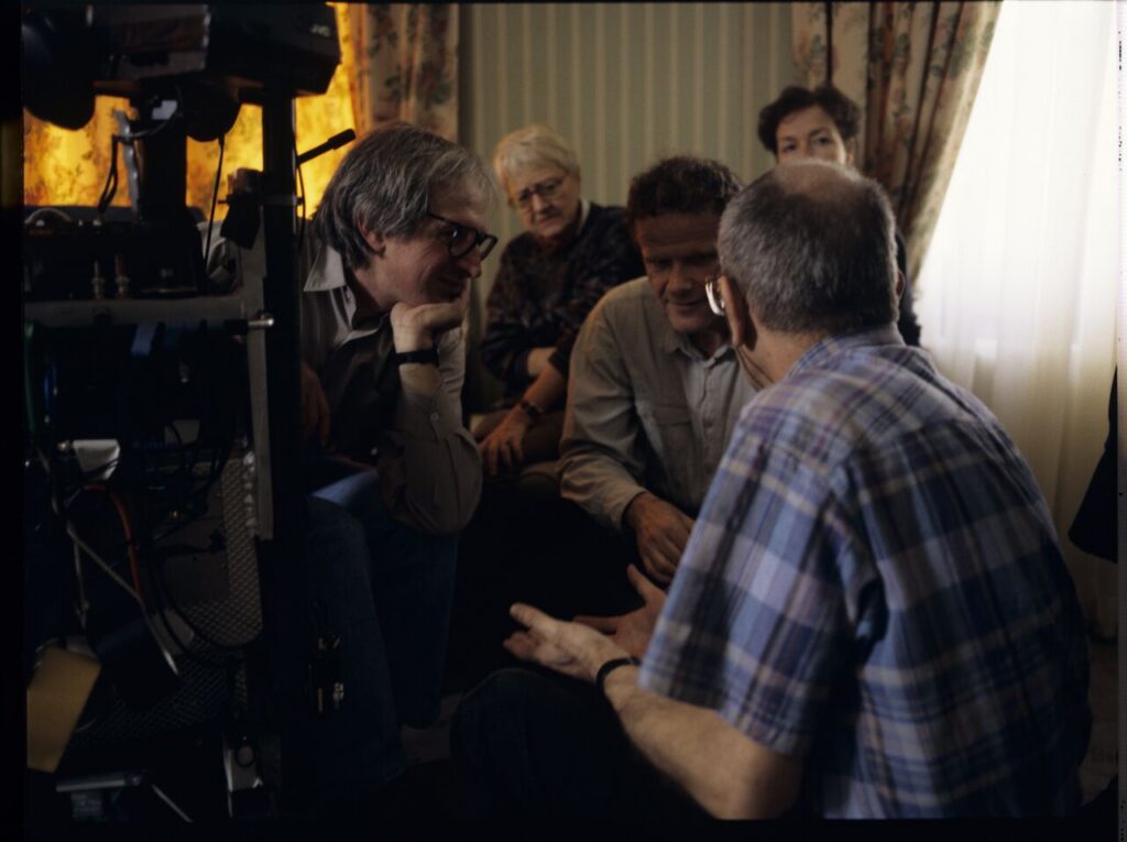 Krzysztof Kieslowski (director) talks with Jean-Claude Laureux (sound editor) with the assistance of translator Roman Gren.