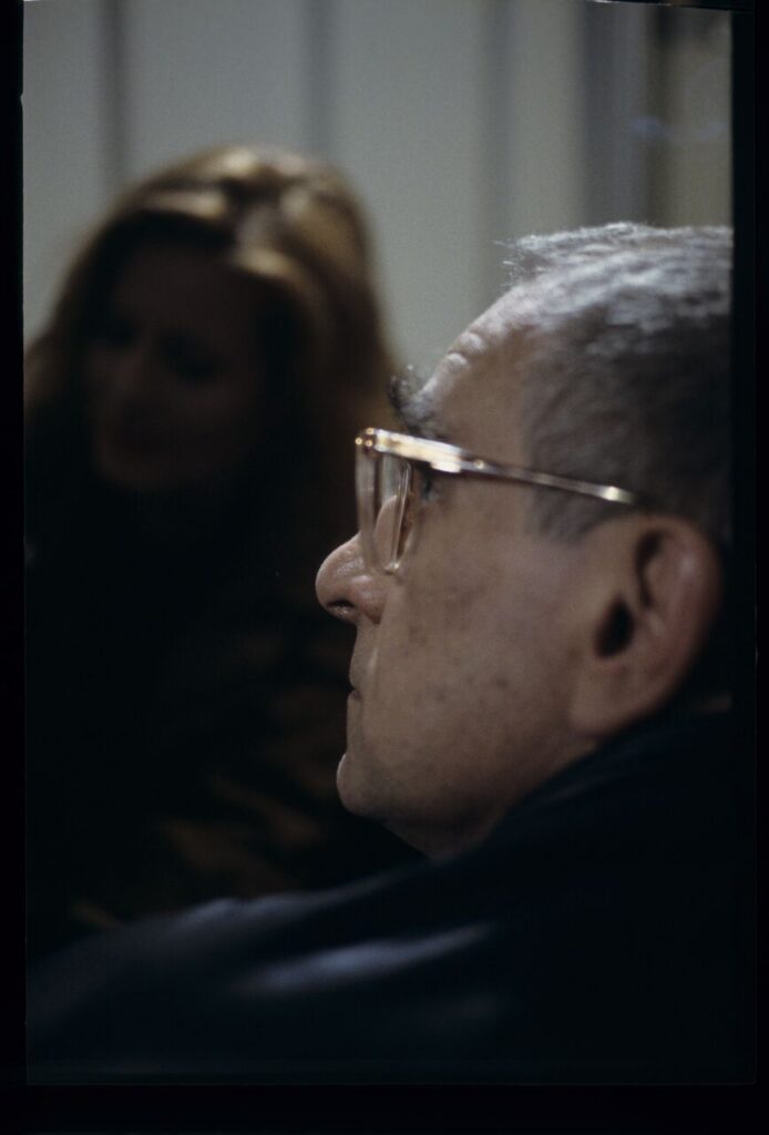 Krzysztof Kieślowski (director) on the set. In the background is actress Grażyna Szapołowska.
