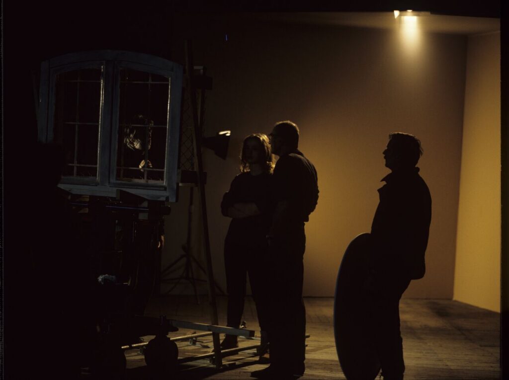 A set in a film studio, where a mock prison window was built.