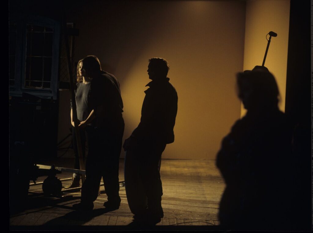 A set in a film studio, where a mock prison window was built.