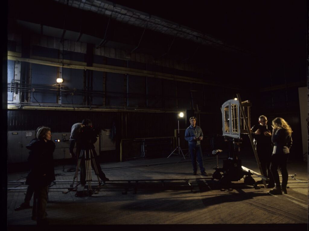 A set in a film studio, where a mock prison window was built.