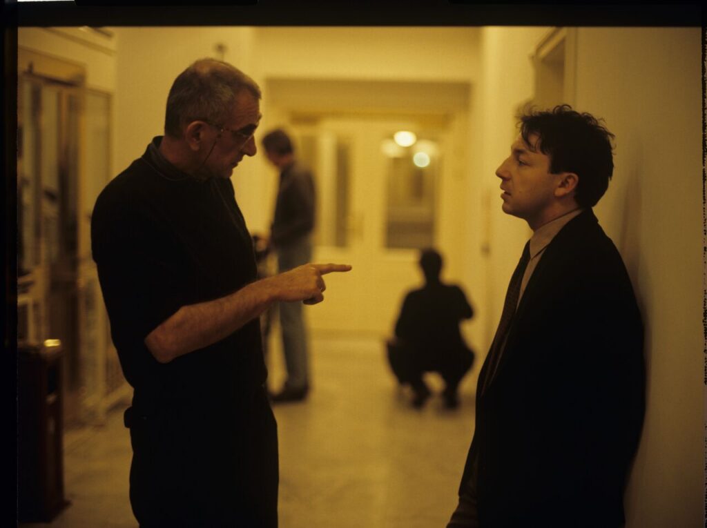 Krzysztof Kieślowski (director) gives directions to actor Zbigniew Zamachowski (playing Karol).