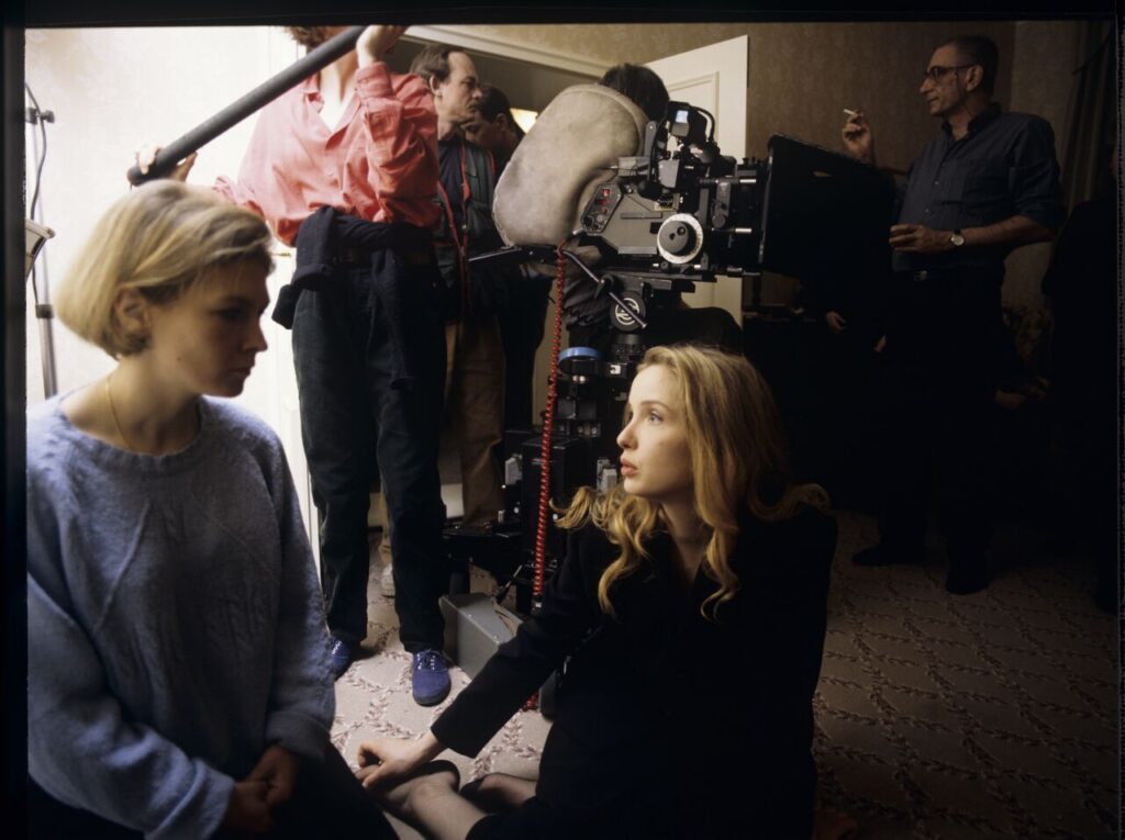The crew on set in a hotel room.