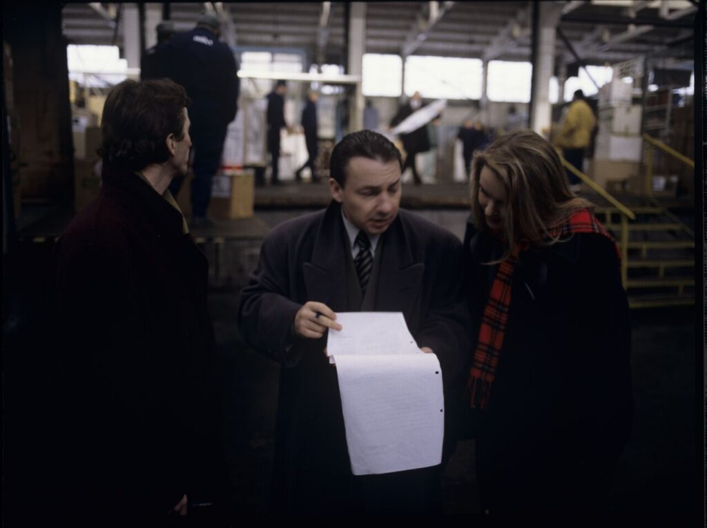 Karol (Zbigniew Zamachowski) with workers of his new company.