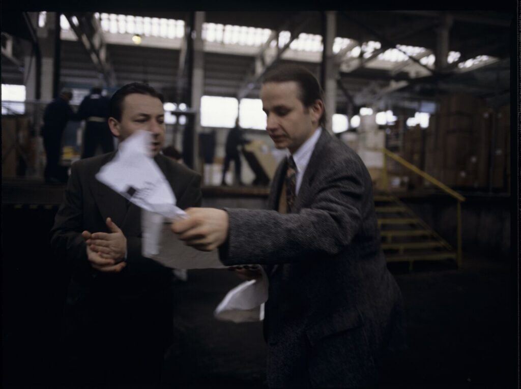 Karol (Zbigniew Zamachowski), as an efficient businessman, analyzes the documents.
