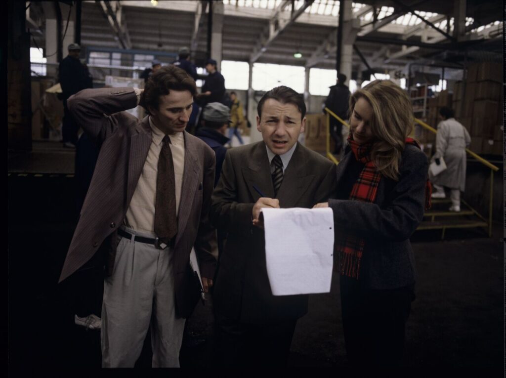Karol (Zbigniew Zamachowski), as an efficient businessman, deals with the employees of his new company.