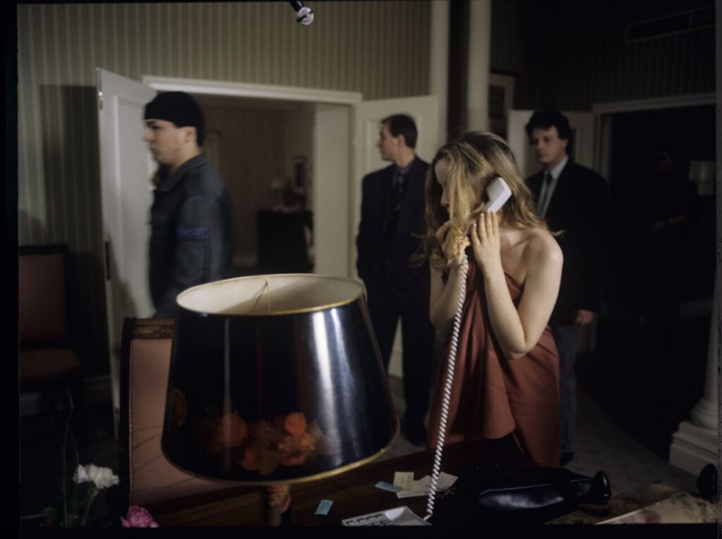 Dominique (Julie Delpy) lets the police into her hotel suite.