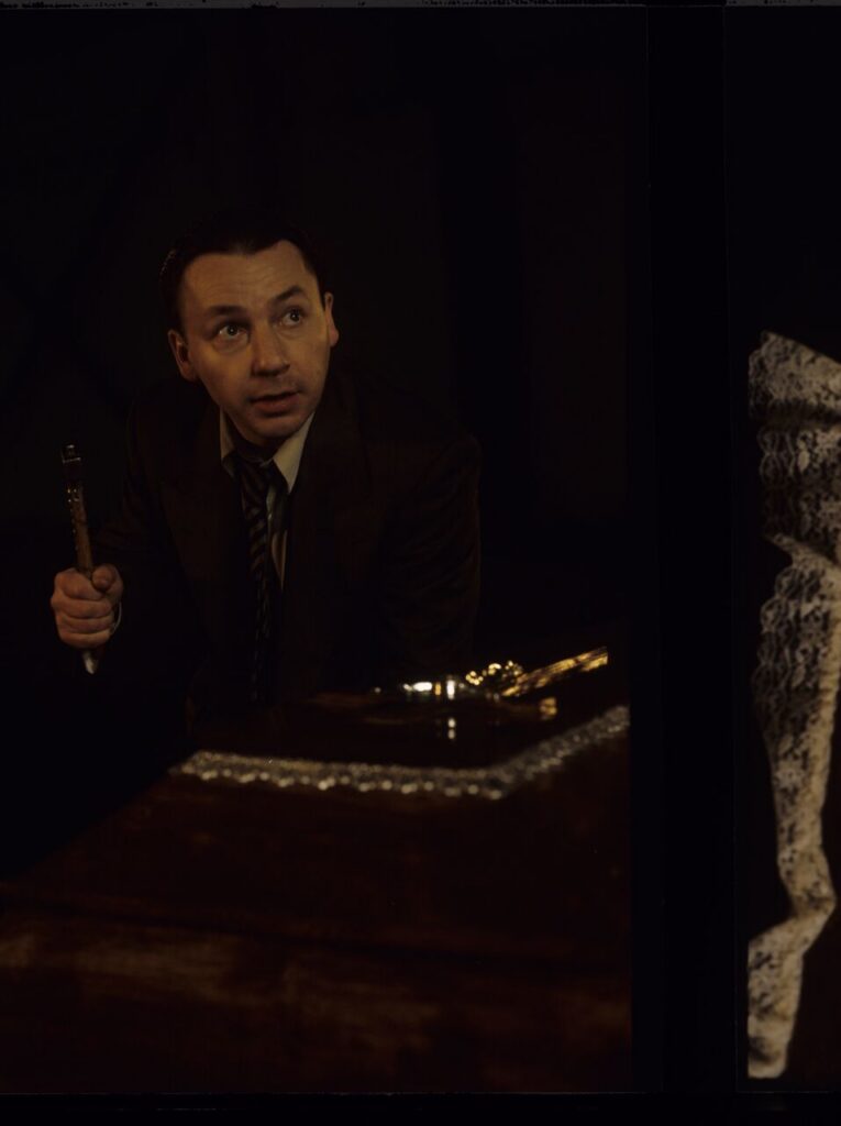 Karol (Zbigniew Zamachowski) nails the coffin containing a "bought" corpse.