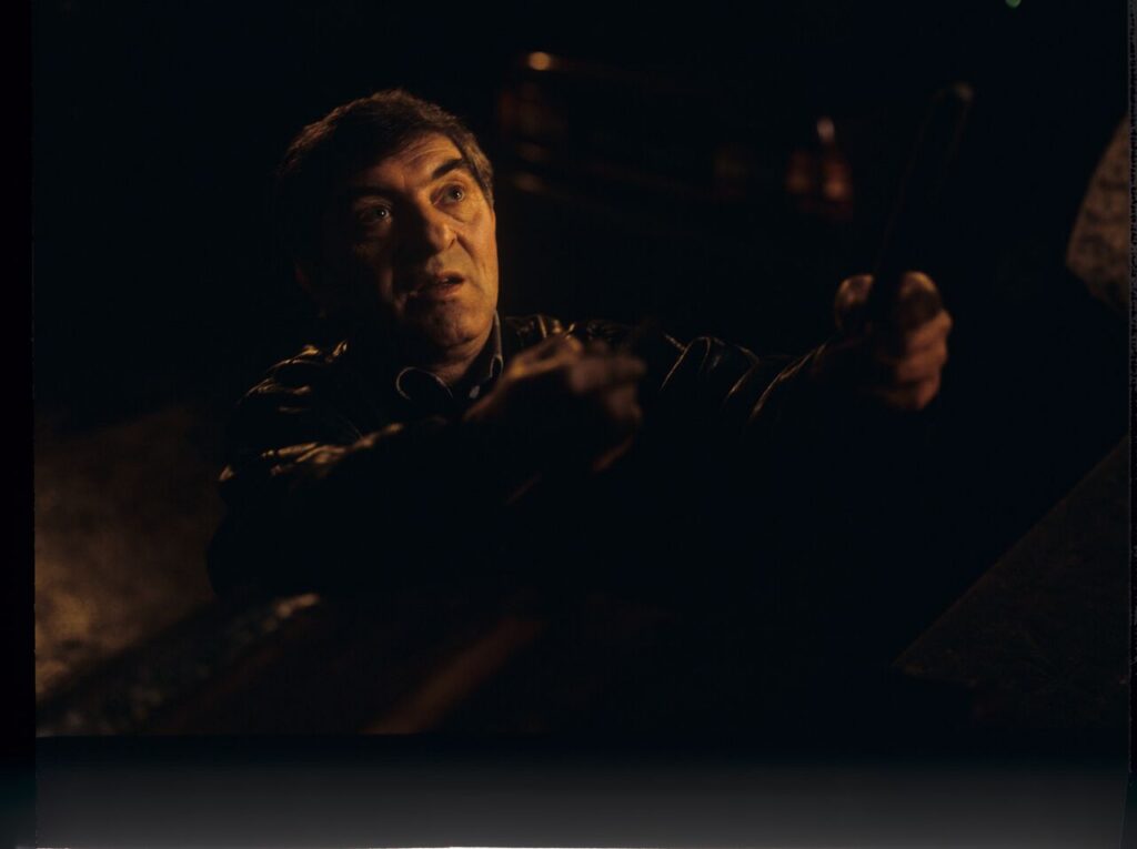 Mr. Bronek (Jerzy Trela), who is not only Karol's driver but also a trusted intermediary for handling difficult matters.