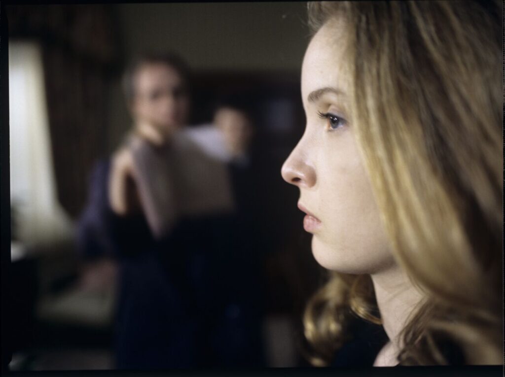 Dominique (Julie Delpy) in the scene where she is arrested by the police on suspicion of murdering her husband.