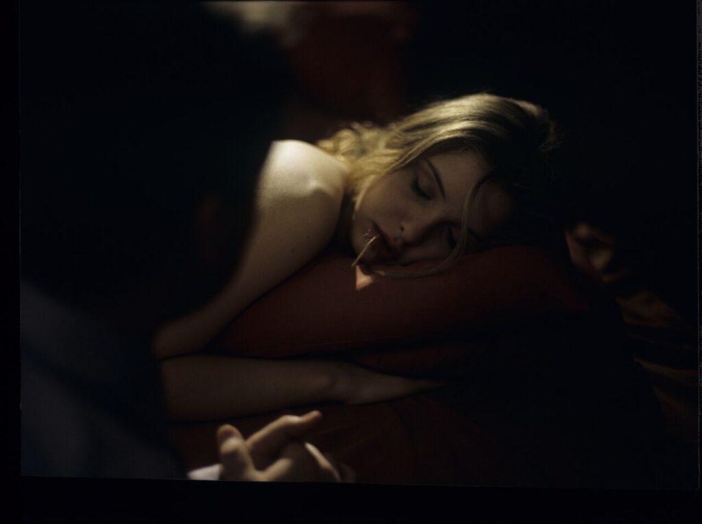 After spending the night together, Karol (Zbigniew Zamachowski) watches Dominique (Julie Delpy) sleep.