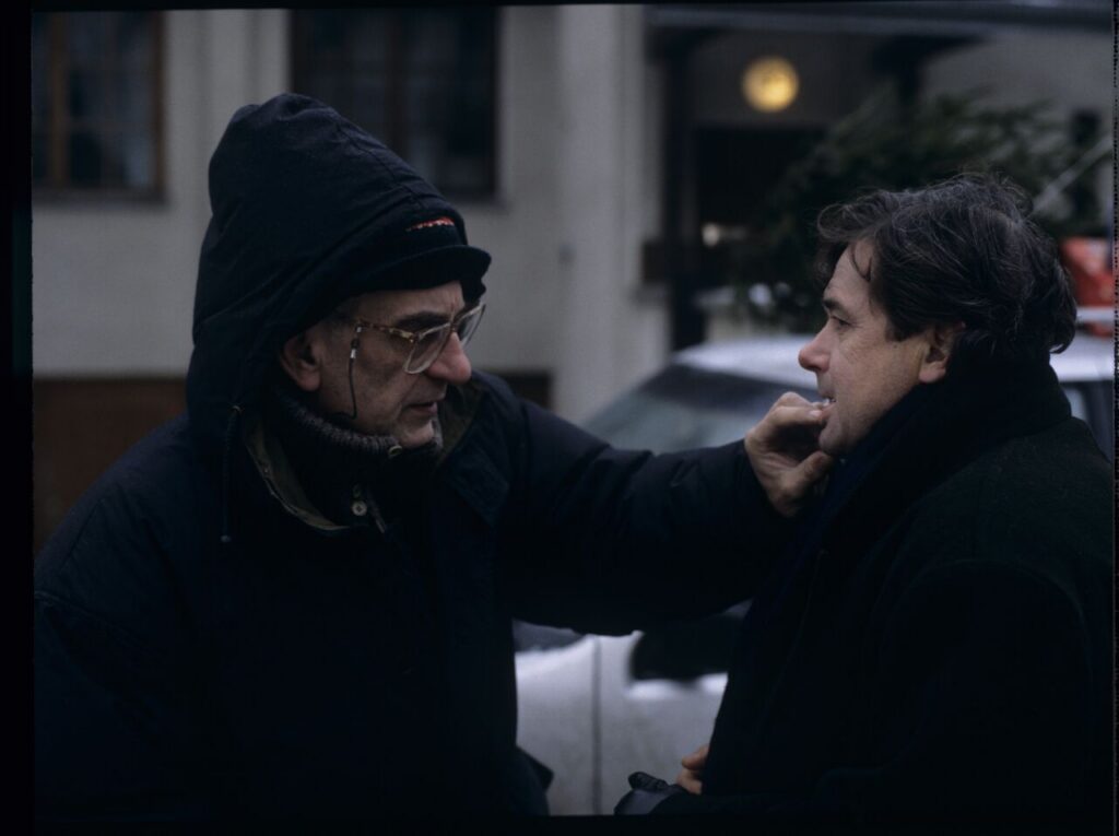 Krzysztof Kieslowsaki (director) gives instructions to Janusz Gajos (playing Mikołaj) on the set.