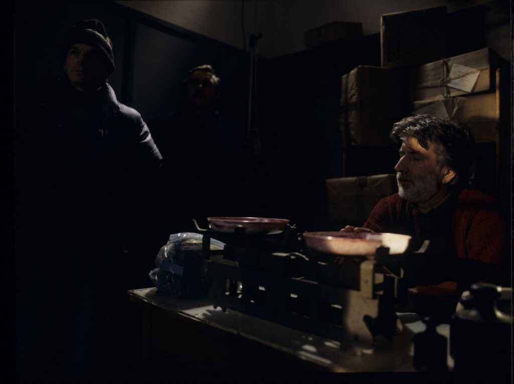 Edward Kłosiński (cinematographer) surrounded by the crew while working on the set.