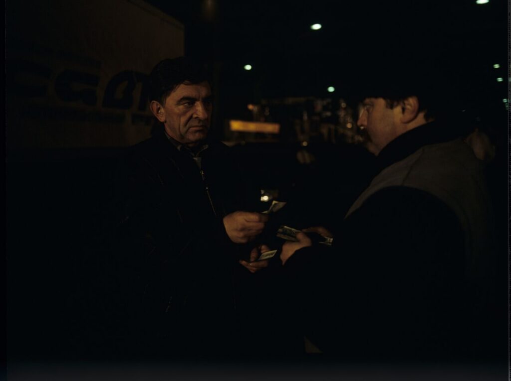 Mr. Bronek (Jerzy Trela) finalizes the deal of smuggling the deceased to fake the death of Karol.