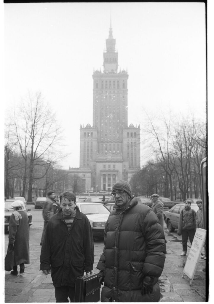 K. Kieślowski (director) and Z. Zamachowski (playing Karol) on the set near the Palace of Culture and Science in Warsaw.