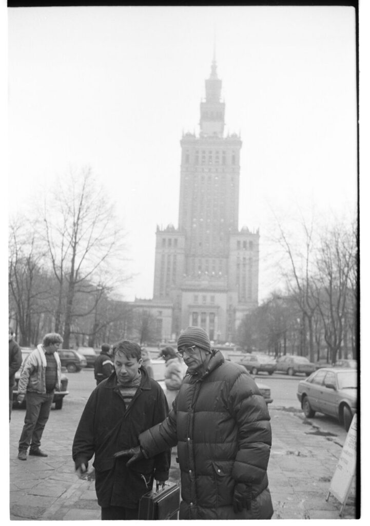 K. Kieślowski (director) and Z. Zamachowski (playing Karol) on the set near the Palace of Culture and Science in Warsaw.
