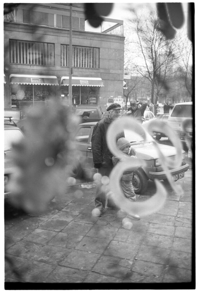A Warsaw street seen through the window of a liquor store.
