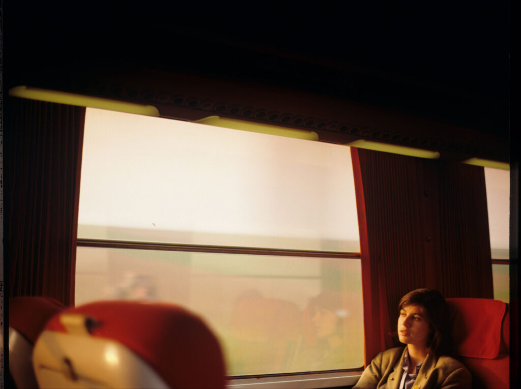 Valentine (Irène Jacob) during a train ride. The scene was not included in the film.
