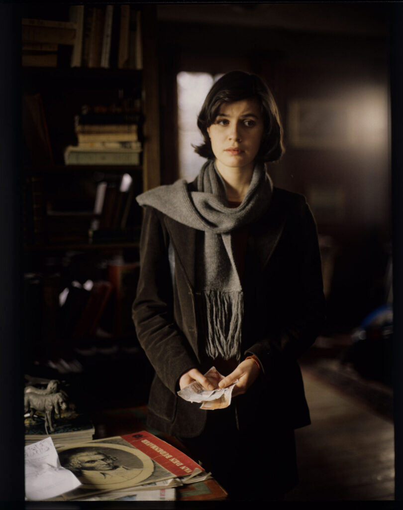 Valentine (Irène Jacob) looks out the window of the judge's apartment.