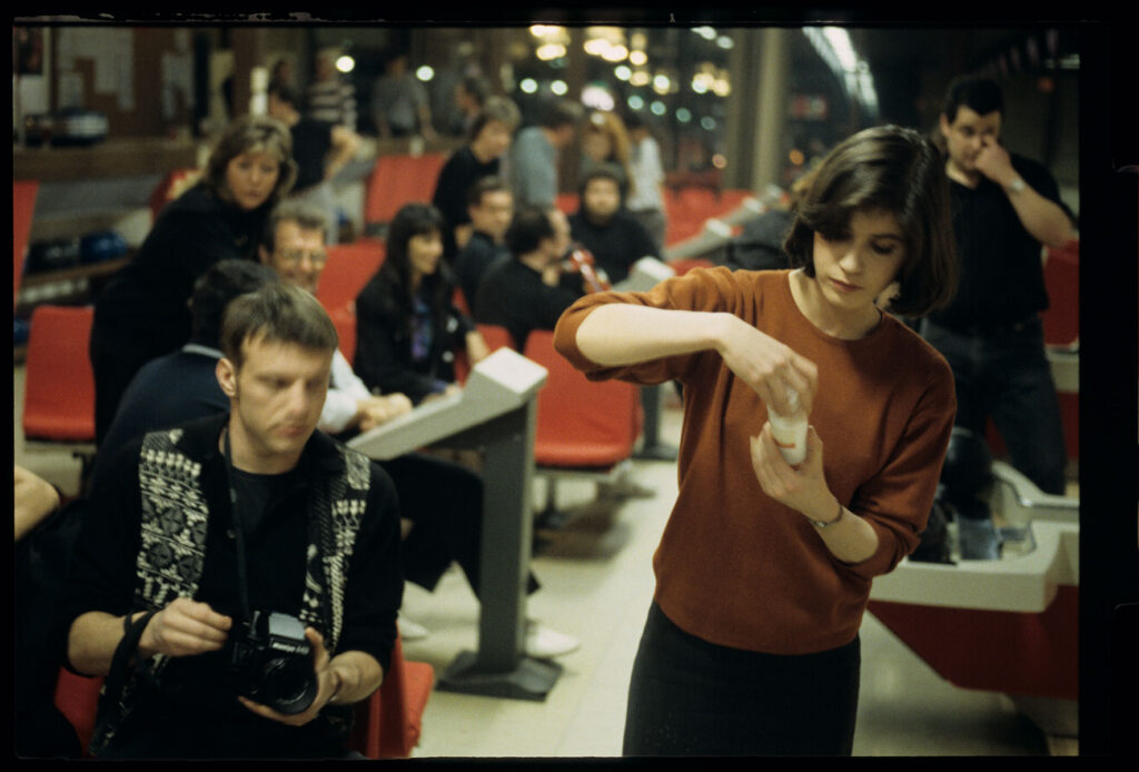 The main character of the film Valentine (Irène Jacob) in a bowling alley.