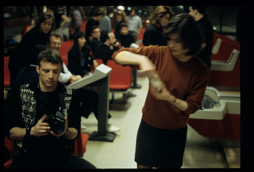 The main character of the film Valentine (Irène Jacob) in a bowling alley.