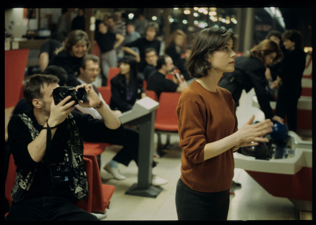 The main character of the film Valentine (Irène Jacob) in a bowling alley.