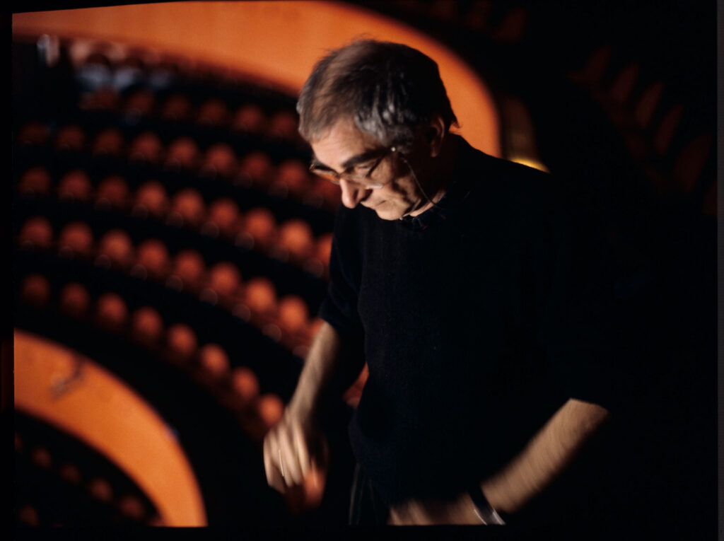 Kieślowski (director) in the audience of the theater where the fashion show with Valentine's participation took place.