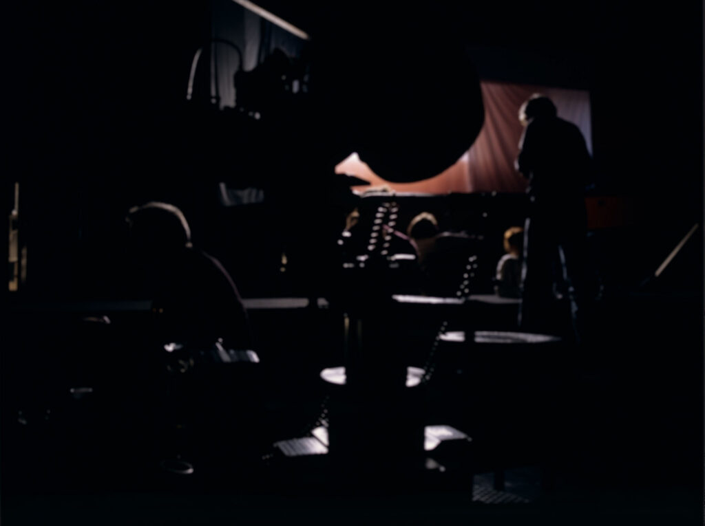 Filming a scene in the theatre's orchestra pit.