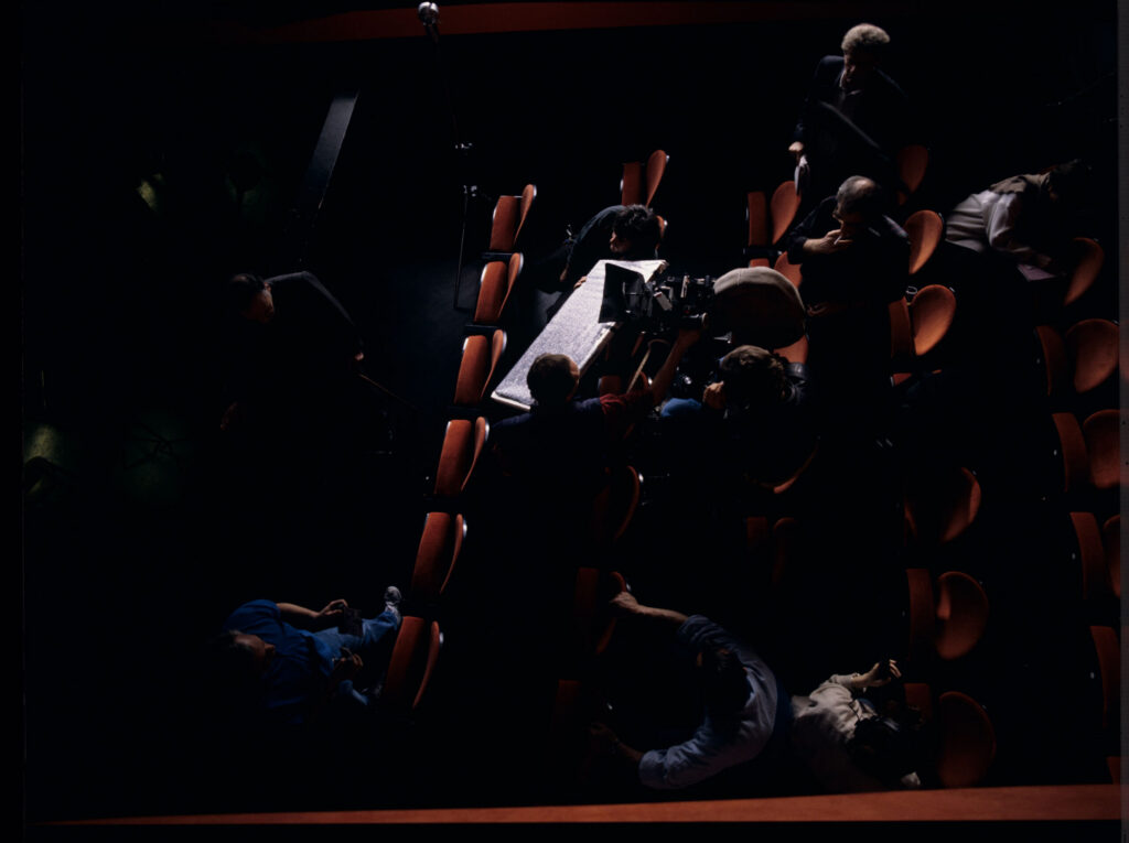 The crew while filming a scene in the theater audience.