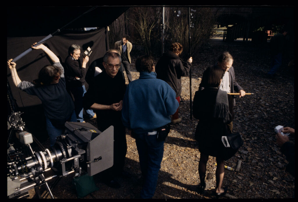 A film set in front of a judge's house. Part of the film crew is preparing to shoot a shot.