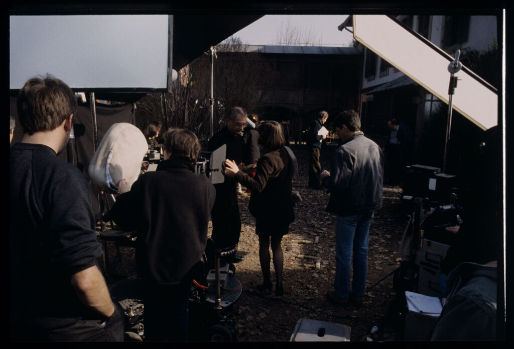 Kieślowski (director) gives instructions to Jacob (Valentine) during the filming of the scene in front of the judge's house.