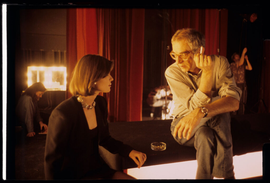 Kieślowski (director) and Jacob (playing Valentine) backstage at the theater during the filming of a fashion show.