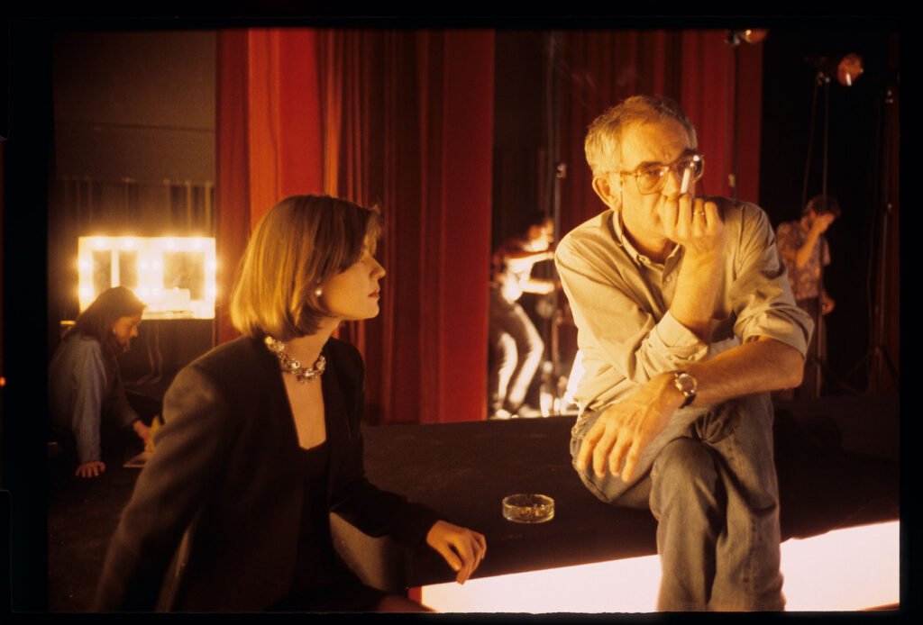 Kieślowski (director) and Jacob (playing Valentine) backstage at the theater during the filming of a fashion show.