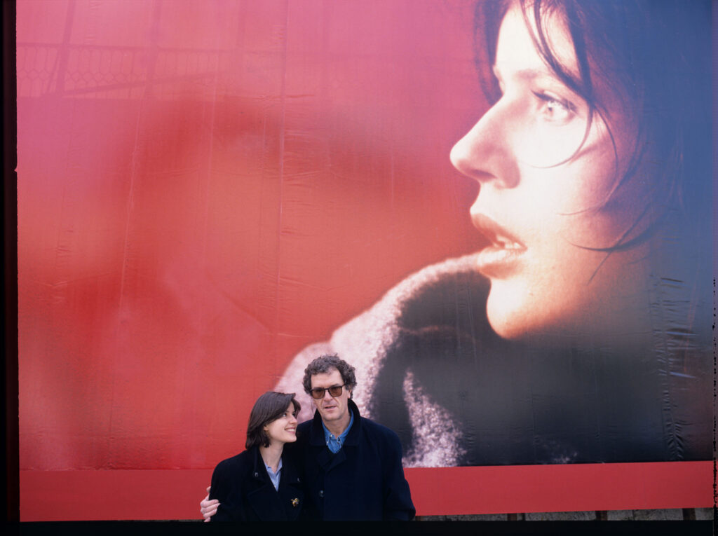 A souvenir photo of actress Jacob and stills photographer Jaxa in front of an advertising billboard with Valentine's image.