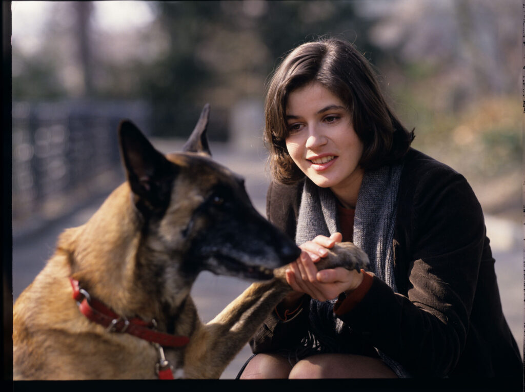 Valentine (Irène Jacob) with her dog Rita.