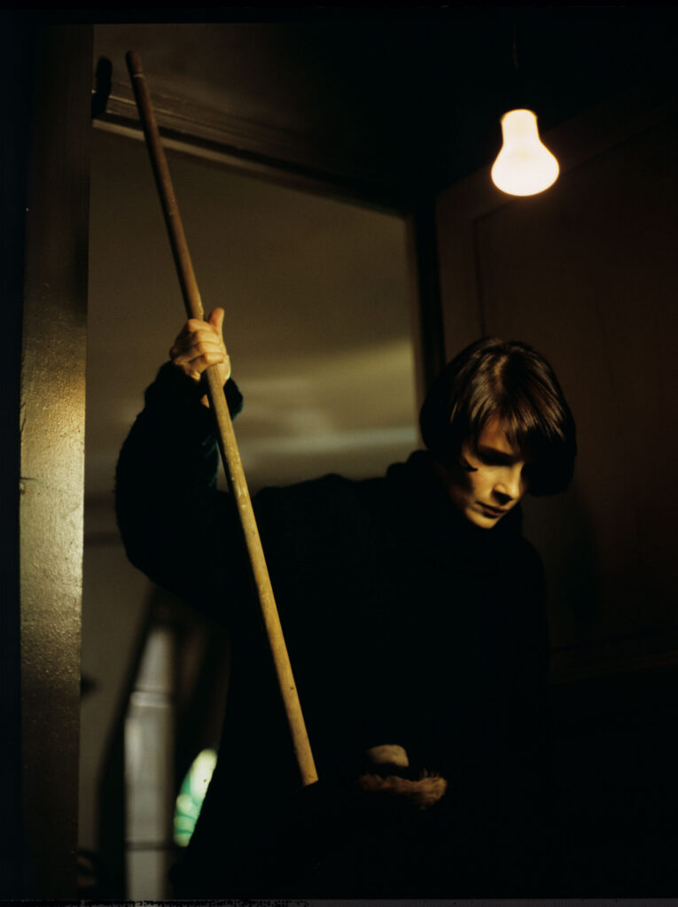 Julie (Juliette Binoche) in her apartment in Paris, with fear lookingat a family of mice she discovered in her cupboard
