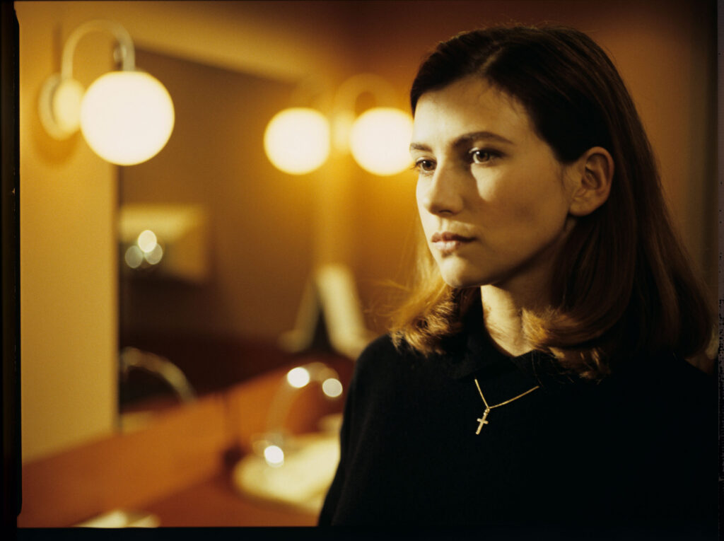Sandrine (Florence Pernel), Patrice de Courcy's lover, during a meeting with Julie in a cafe toilet.