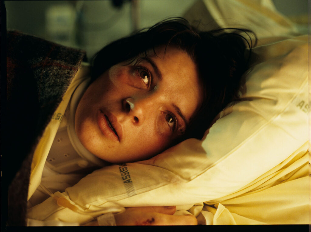 Julie (Juliette Binoche) in the hospital after the car accident, in which her husband and only daughter died
