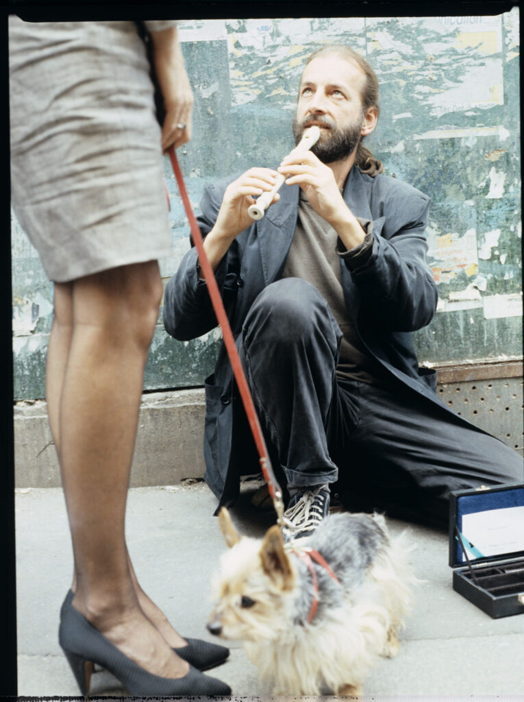 Street flute player (played by Jacek Ostaszewski - Polish composer and jazz musician).