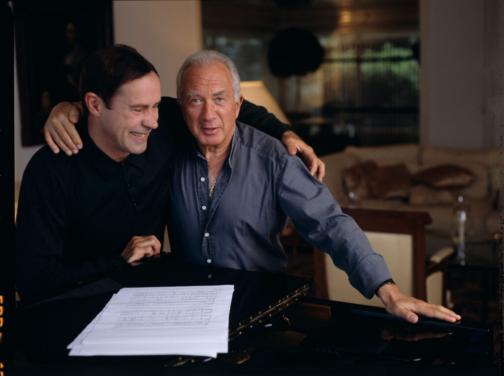 A joint photograph of composer Patrice de Courcy (Hugues Quester) with Alexis Weissenberg, a pianist and musician.