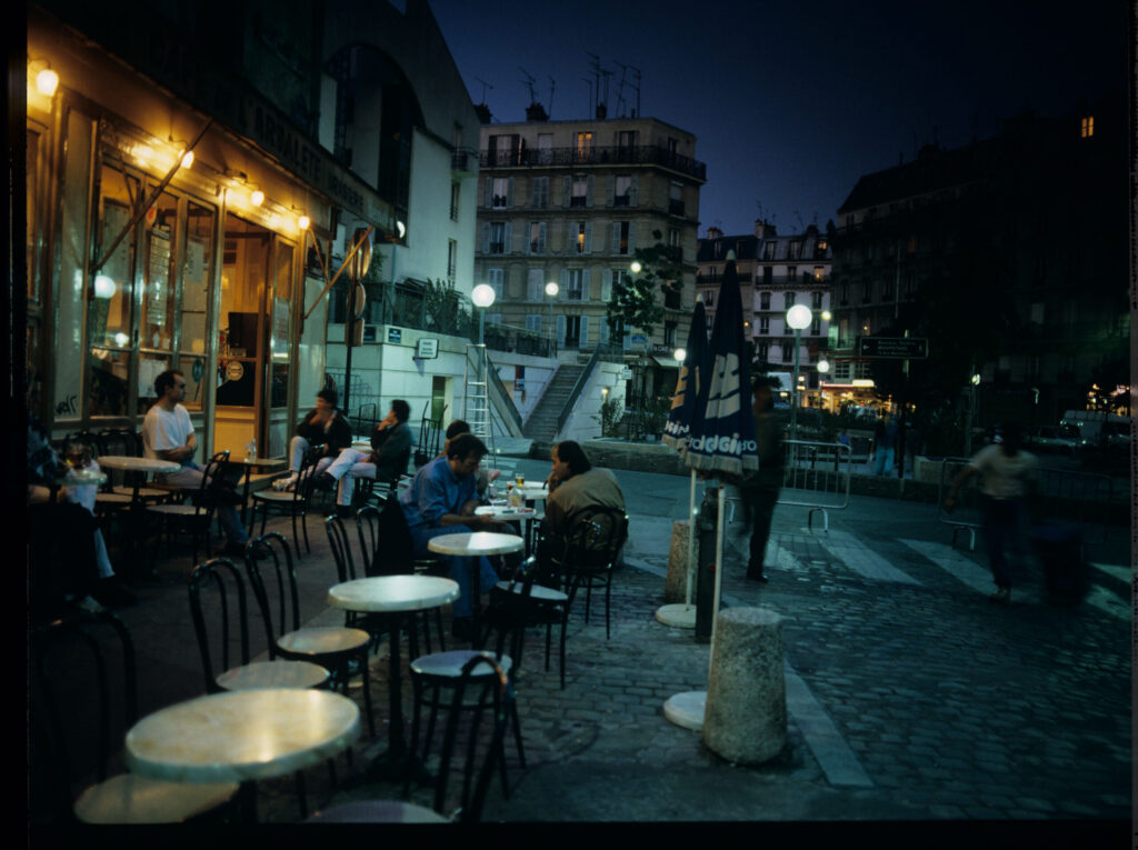 A café on a Parisian street where Julie is a daily guest.