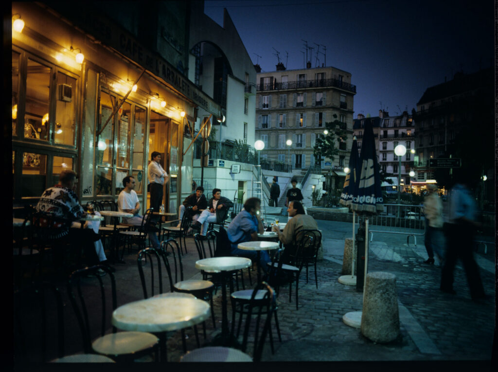 A café on a Parisian street where Julie is a daily guest.
