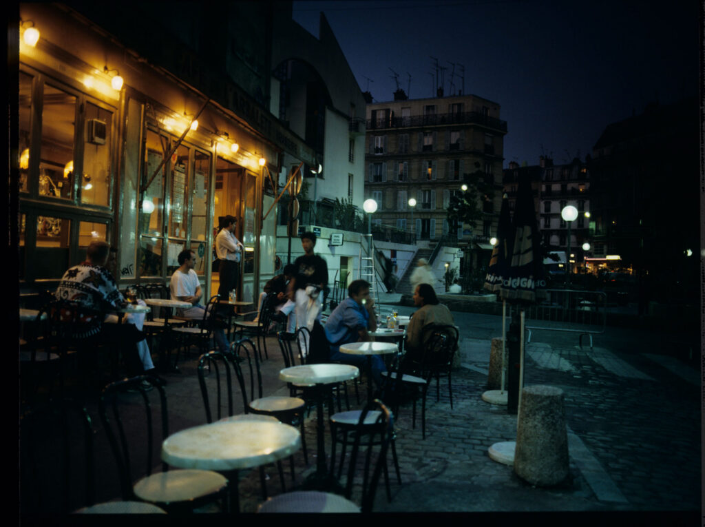 A café on a Parisian street where Julie is a daily guest.