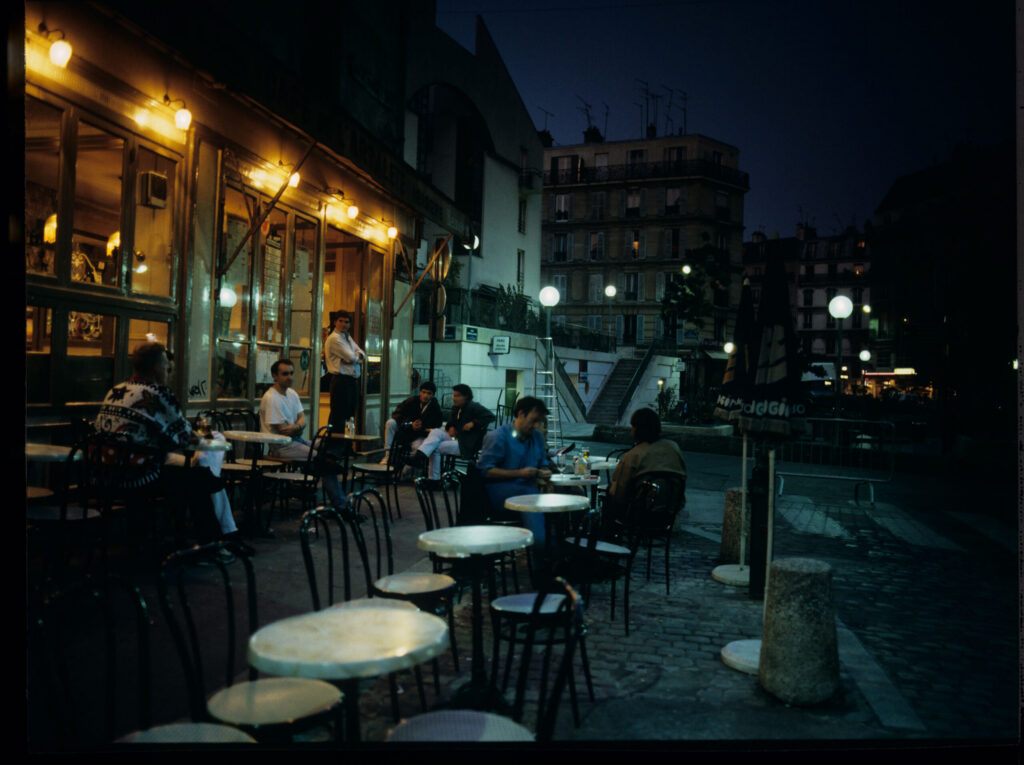 A café on a Parisian street where Julie is a daily guest.