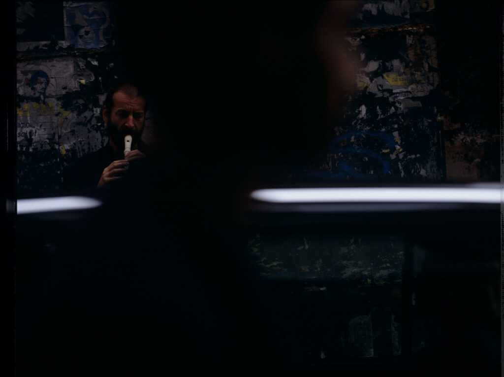 Street flute player (played by Jacek Ostaszewski - Polish composer and jazz musician)