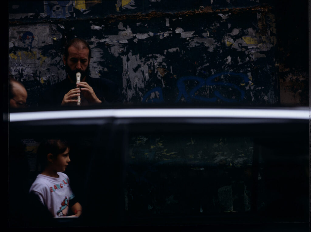Street flute player (played by Jacek Ostaszewski - Polish composer and jazz musician)