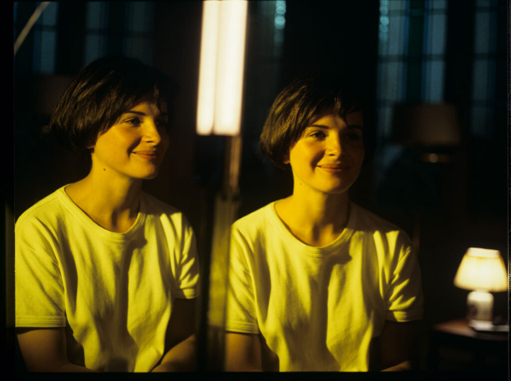 Julie, the main character of the film (Juliette Binoche), looks at her reflection in the mirror.