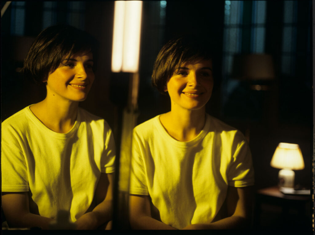 Julie, the main character of the film (Juliette Binoche), looks at her reflection in the mirror.