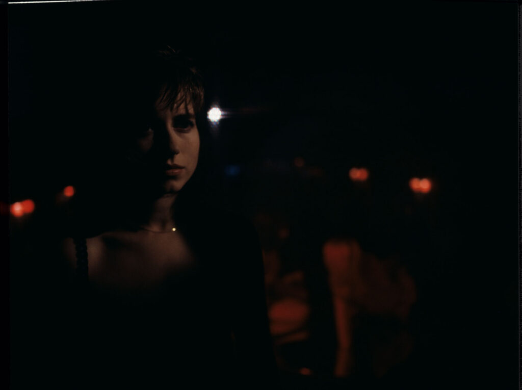Lucille (Charlotte Very), Julie's neighbor who works at a nightclub.
